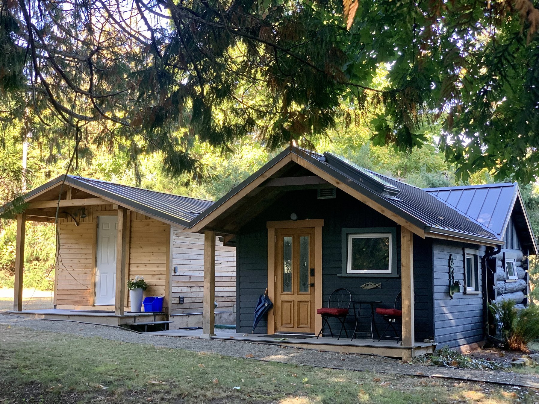 Exterior of the MayneWave cabin among mature trees